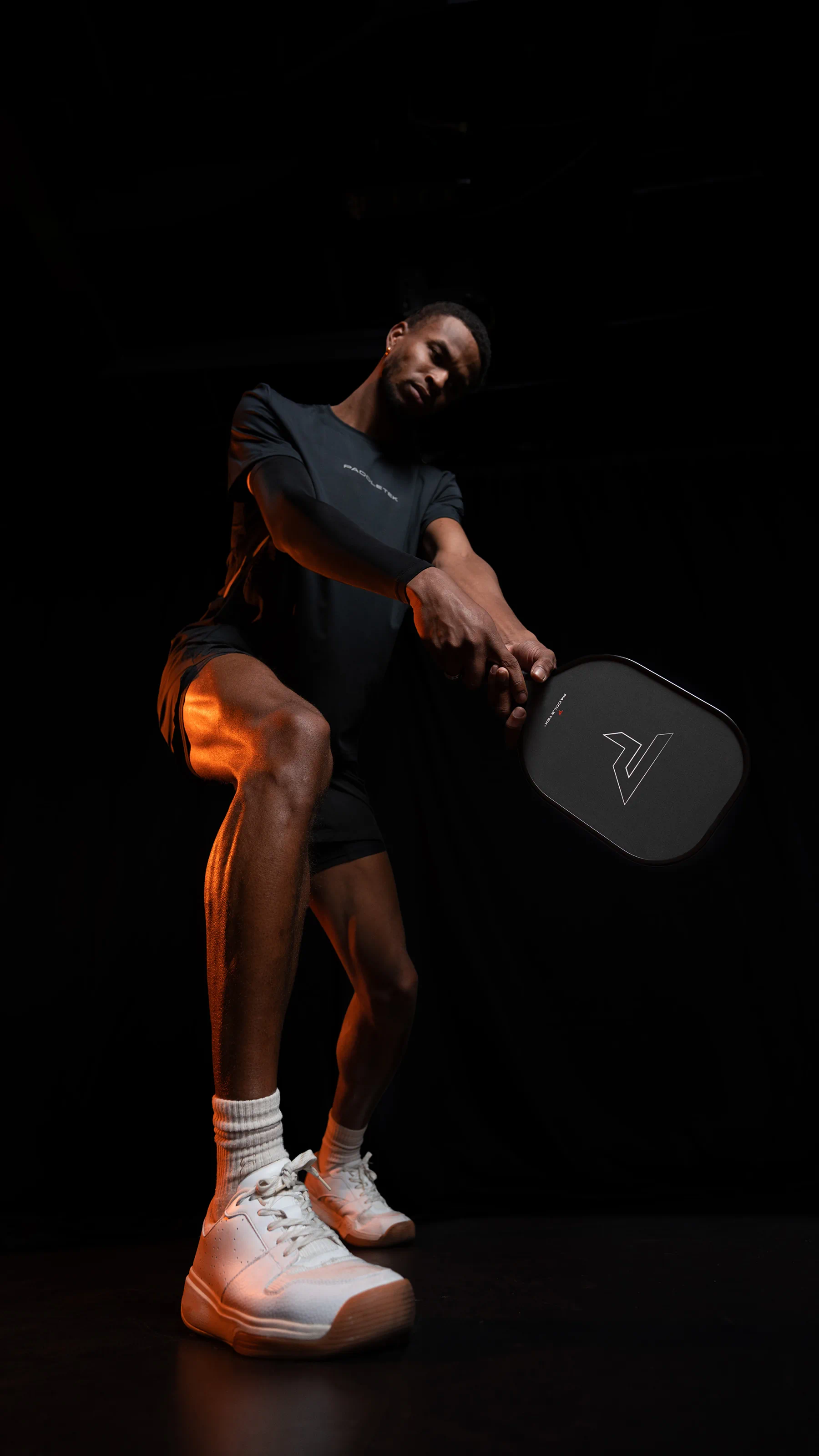 Athlete swinging paddle
